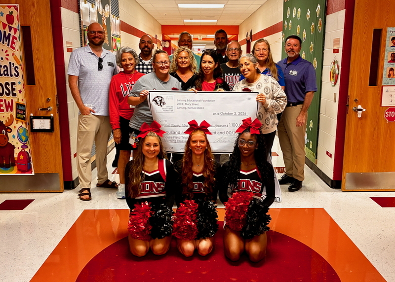 Teacher receiving grant from educational foundation