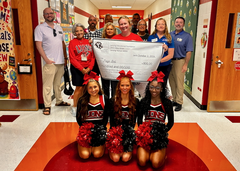 Teacher receiving grant from educational foundation