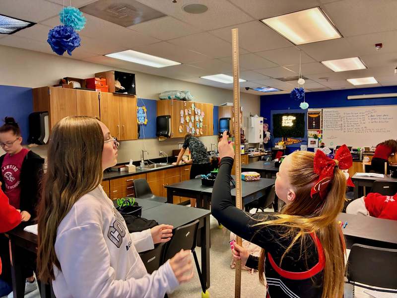 8th grade students doing labs