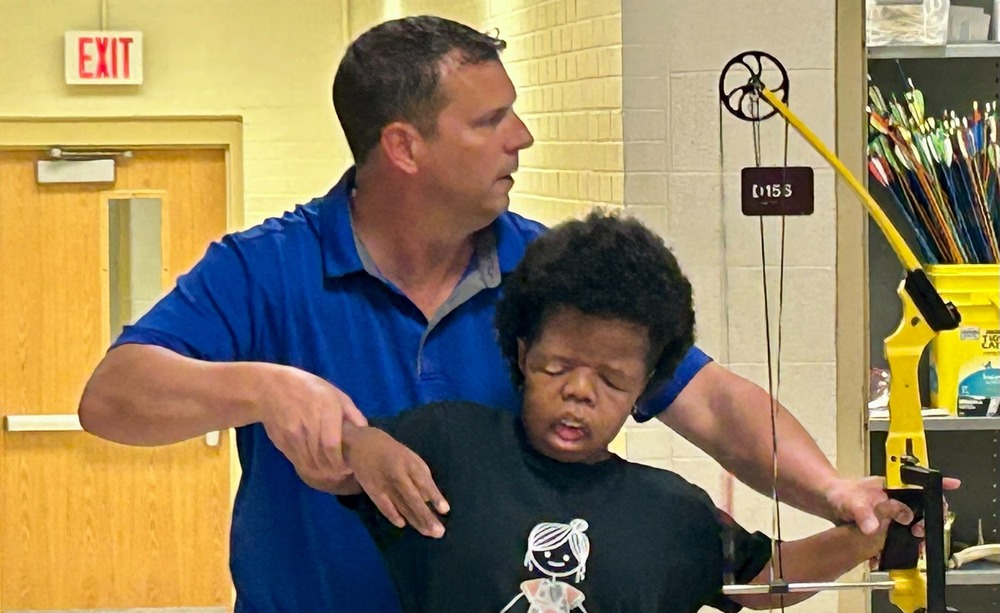 Adaptive Archery class with teacher Chris Prill and student Journee Lally