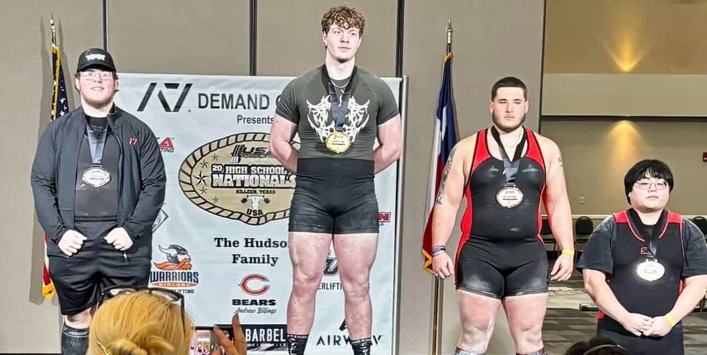 Zane Sanchez in the middle celebrates his national powerlifting championship