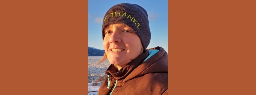 Close up outside photo of Andrea Cook in a brown coat and winter hat