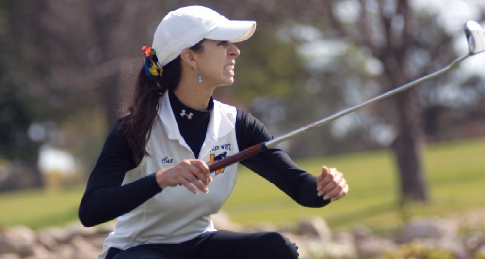 Catherine Benscoter playing golf for Lapeer West
