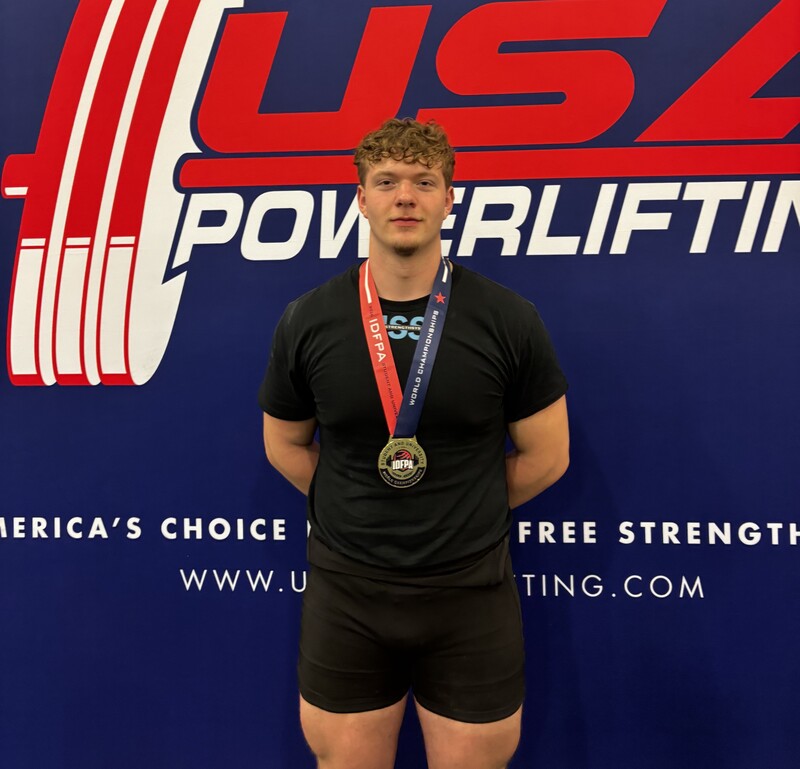 Zane Sanchez posing alone at the world powerlifting championships in Florida