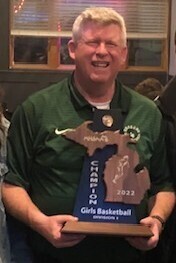 Bob Brydges with girls basketball trophy