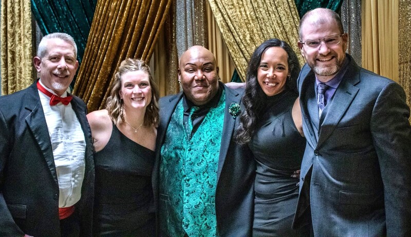 Five Lapeer band and music directors dressed up for an event