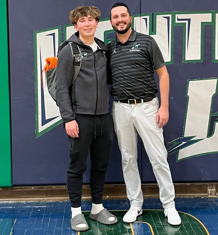 Lapeer basketball player Will Fisher and coach Jack Chittle