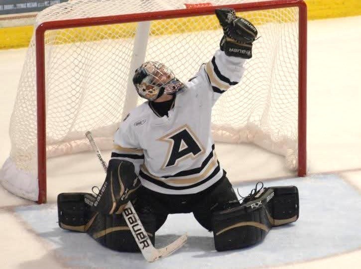Army hockey goalie Robert Tadazak makes a save during a game in 2011.