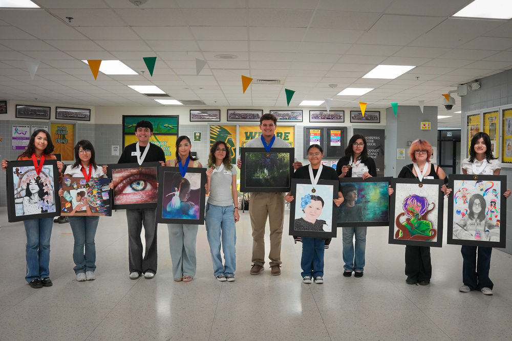 All 10 VMT students that earned top honors at the VASE competition posing for the camera with their art