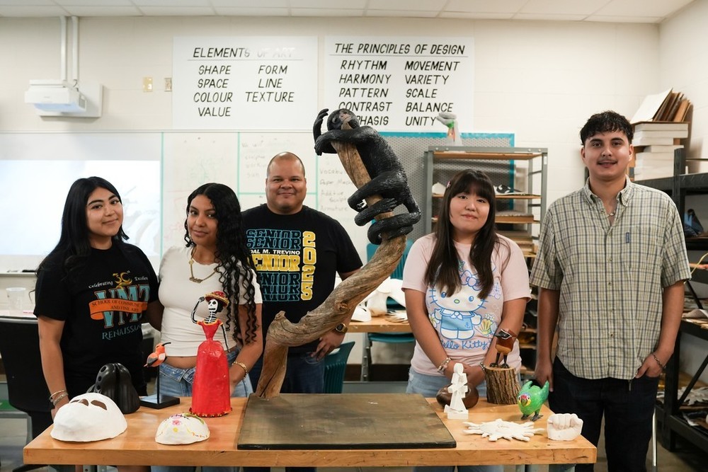 Students and a sculpture