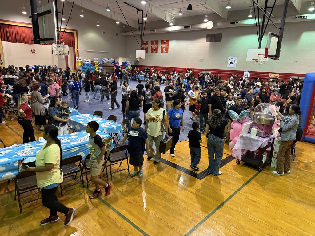 Reading night pic. A gym filled with people playing games, having fun, laughing, and just enjoying themselves.