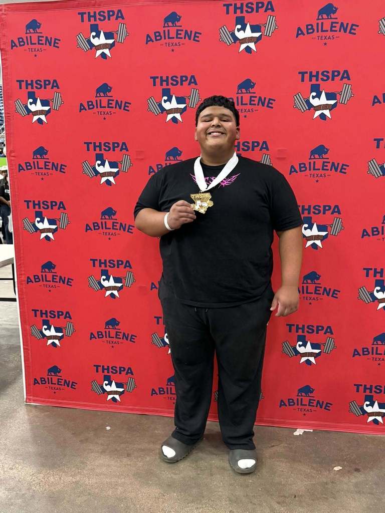 Sergio Javi Martinez posing with a medal after winning state champion 