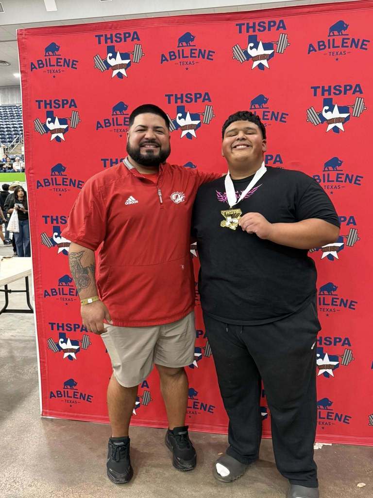 martin high school junior sergio javi martinez posing with coach mark duron after winning state title for powerlifting
