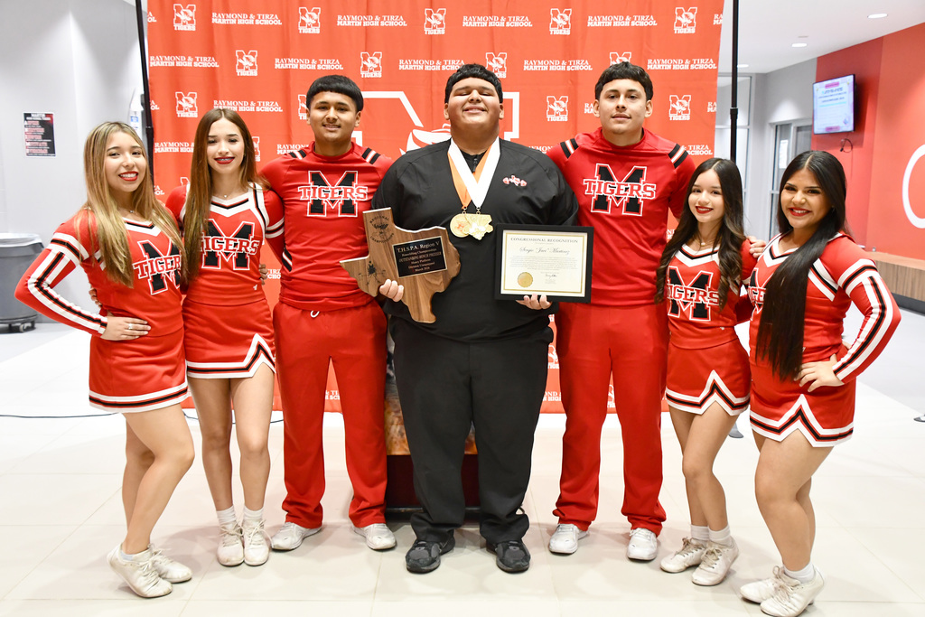 group picture of javi with cheerleaders