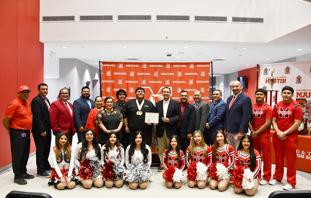 group picture of state powerlifter javi with admin and family members and cheer and Tigerettes