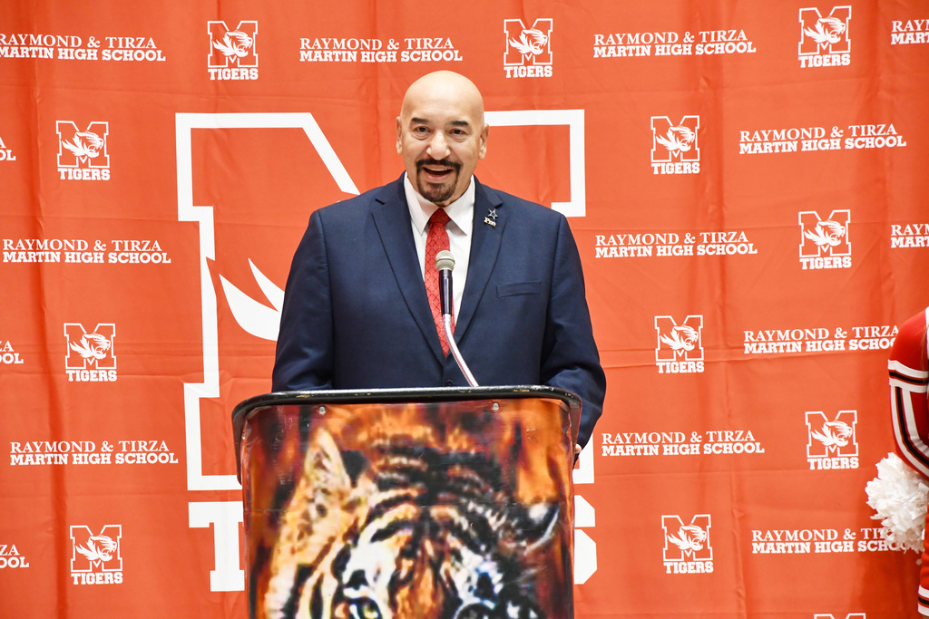 LISD Superintendent Mr. Pro talking at the podium