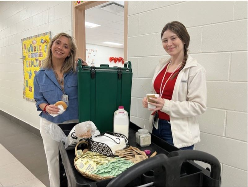 Leadership team walking around serving Starbucks to our teachers