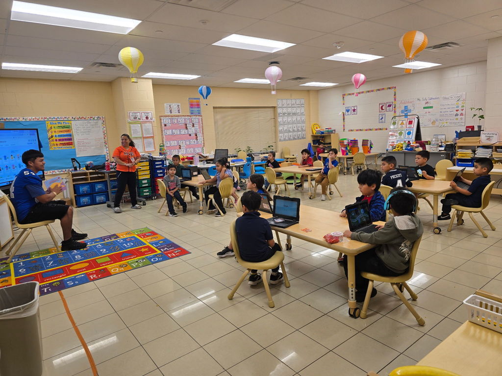 CHS Football team came in to GREET and read to our Kinder students.