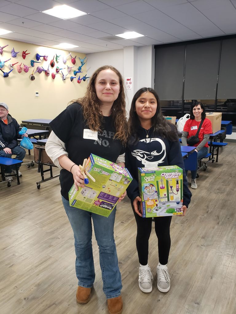 students holding  STEM prizes 