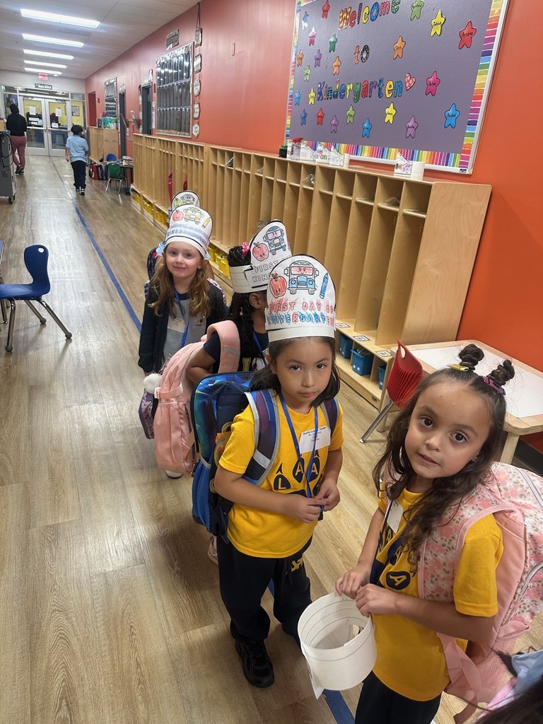 students with Kinder hats