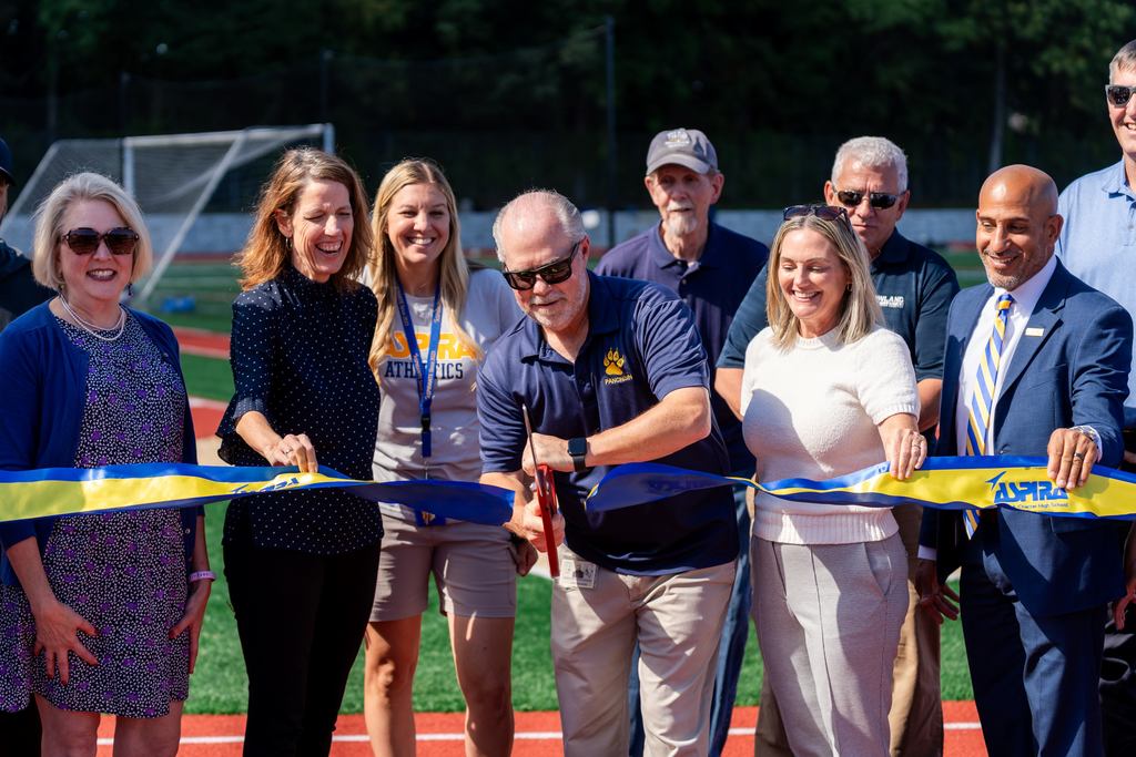 Greg & group cut ribbon