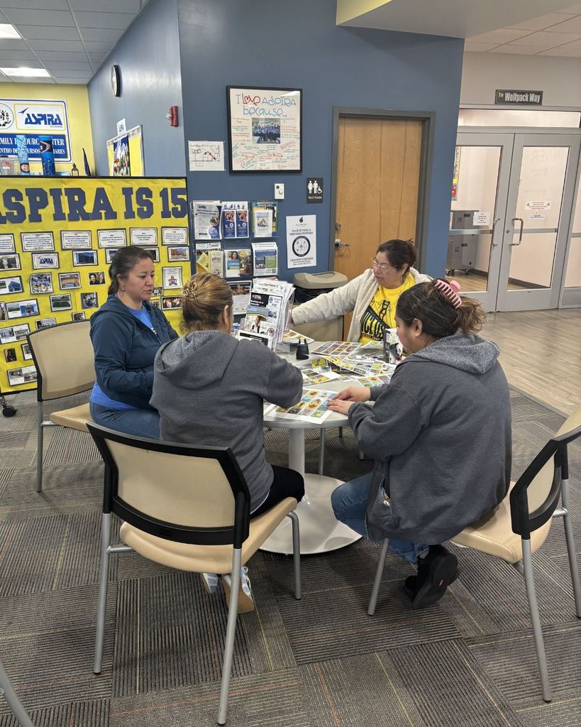 Nutrition Team members in a circle helping to create the mexican loteria cards