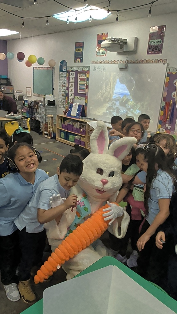 Easter Bunny surrounded by students