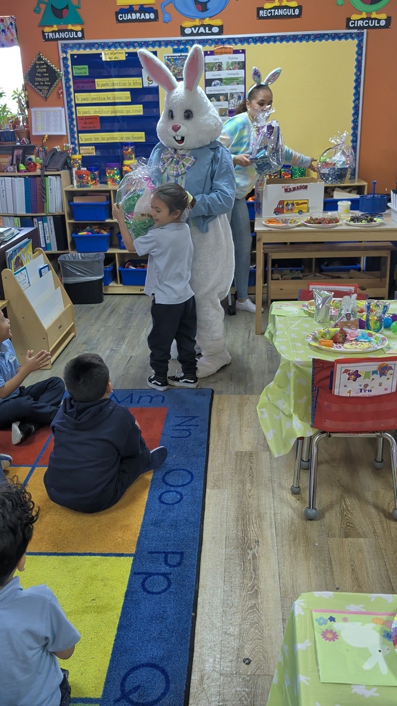 Easter Bunny giving a student an easter gift basket