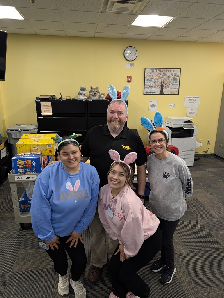 Main desk team members wearing easter bunny headbands