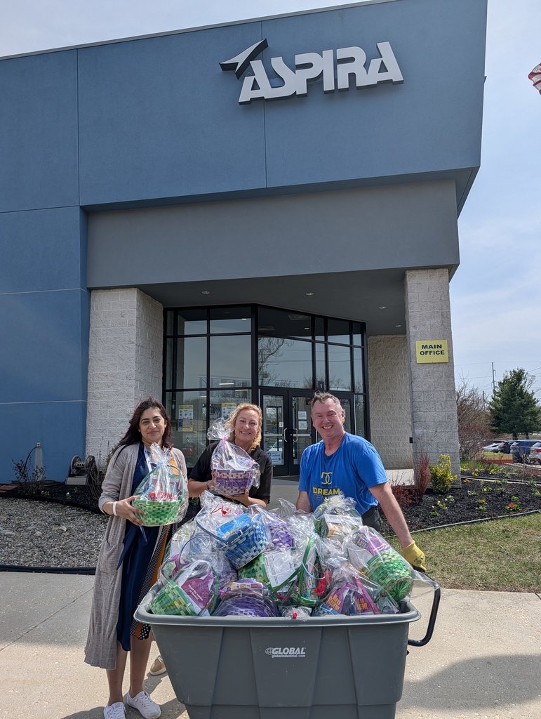ASPIRA team members with dream center staff and gift basket donation
