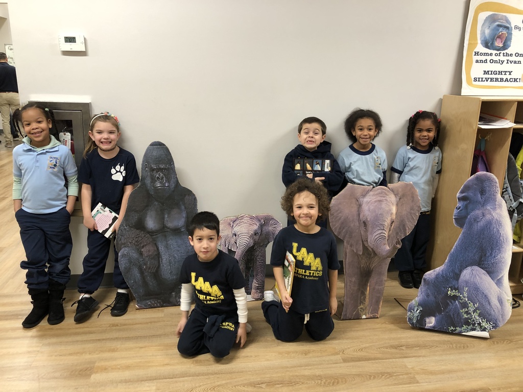 First one school one book Ivan picture of kids next to image of Ivan