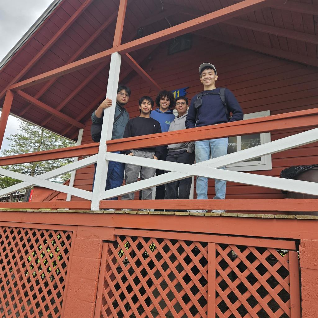 Senior trip to poconos students posing on balcony