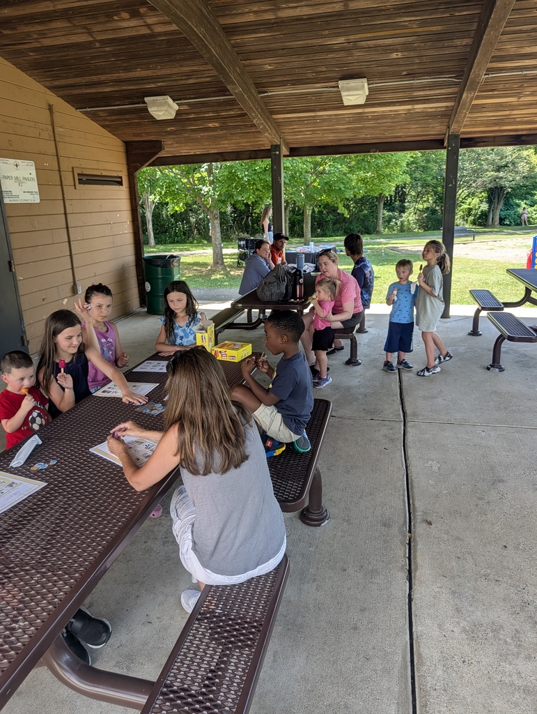teacher and students in the park