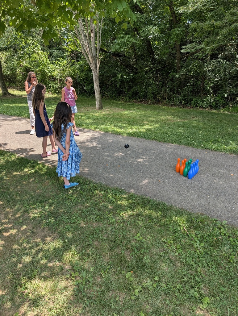 teacher and students playing bowling