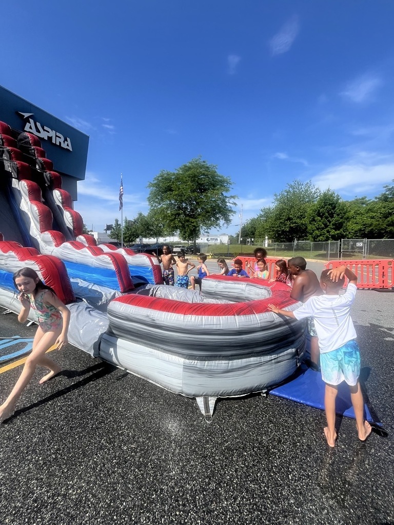students having water fun with a water slide