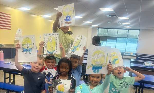 kids showing their minion drawings