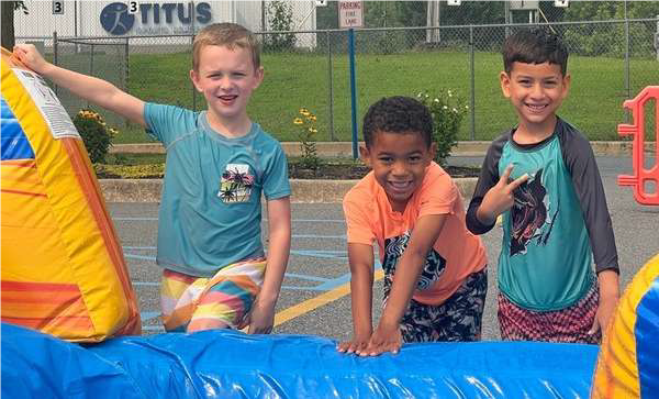 3 kids on water slide