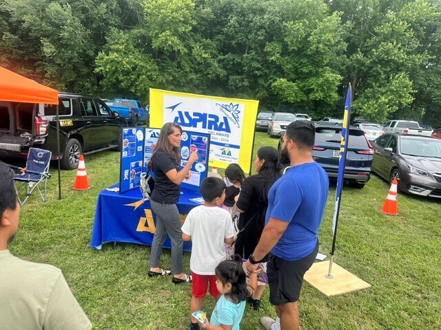 ASPIRA Evelyn with community member
