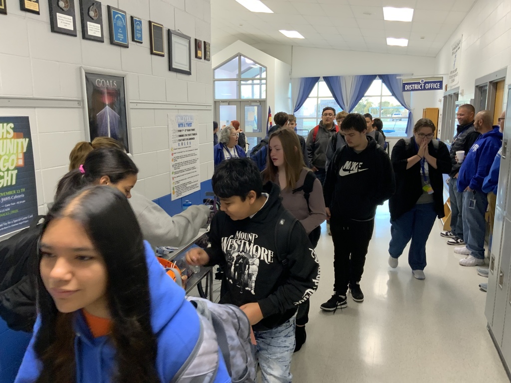 Pure gold members handing out treats