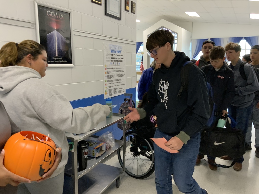 Pure gold members handing out treats