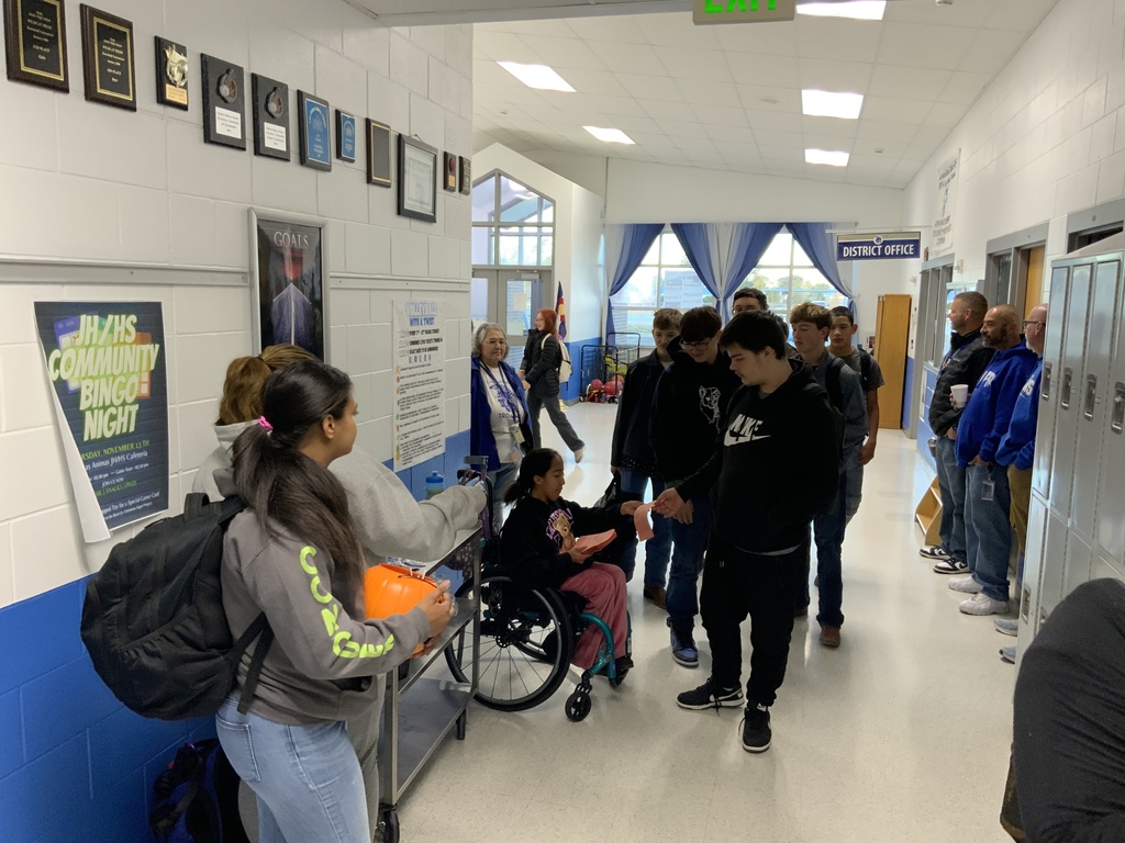 Pure gold members handing out treats