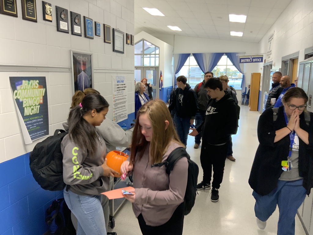 Pure gold members handing out treats