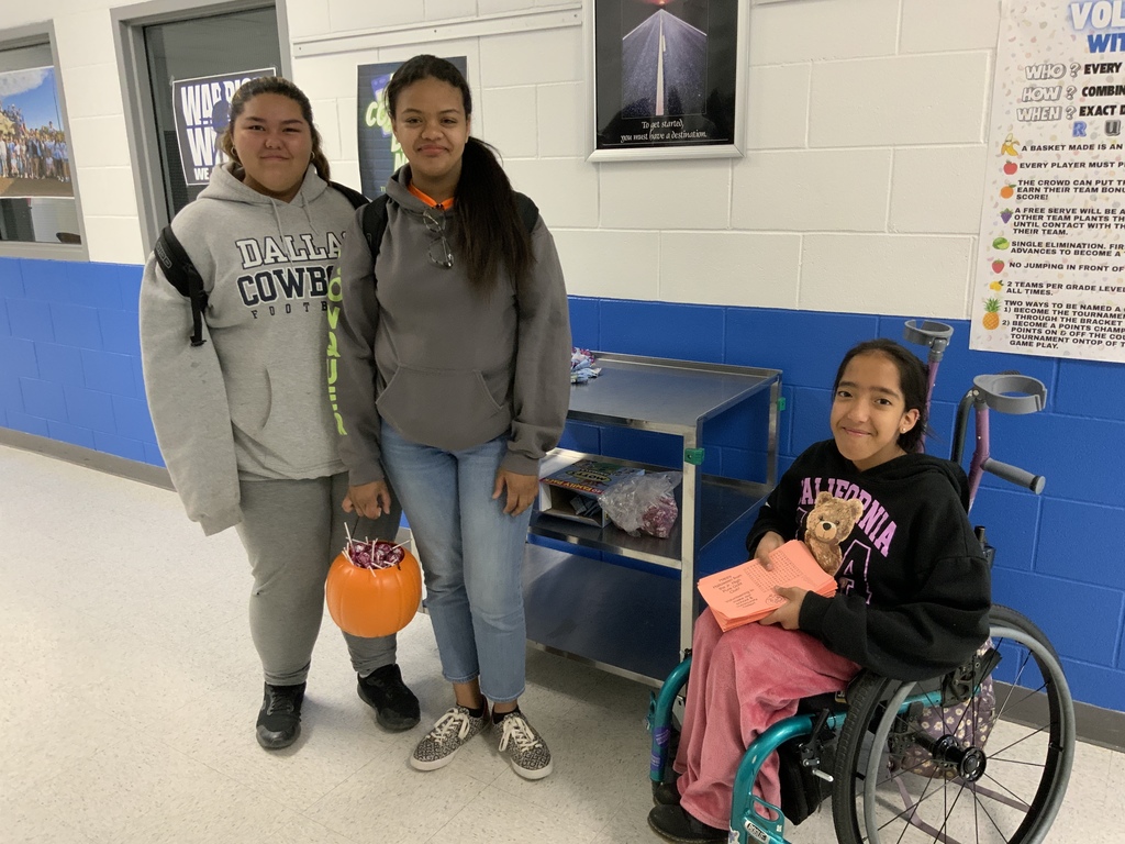 Pure gold members handing out treats