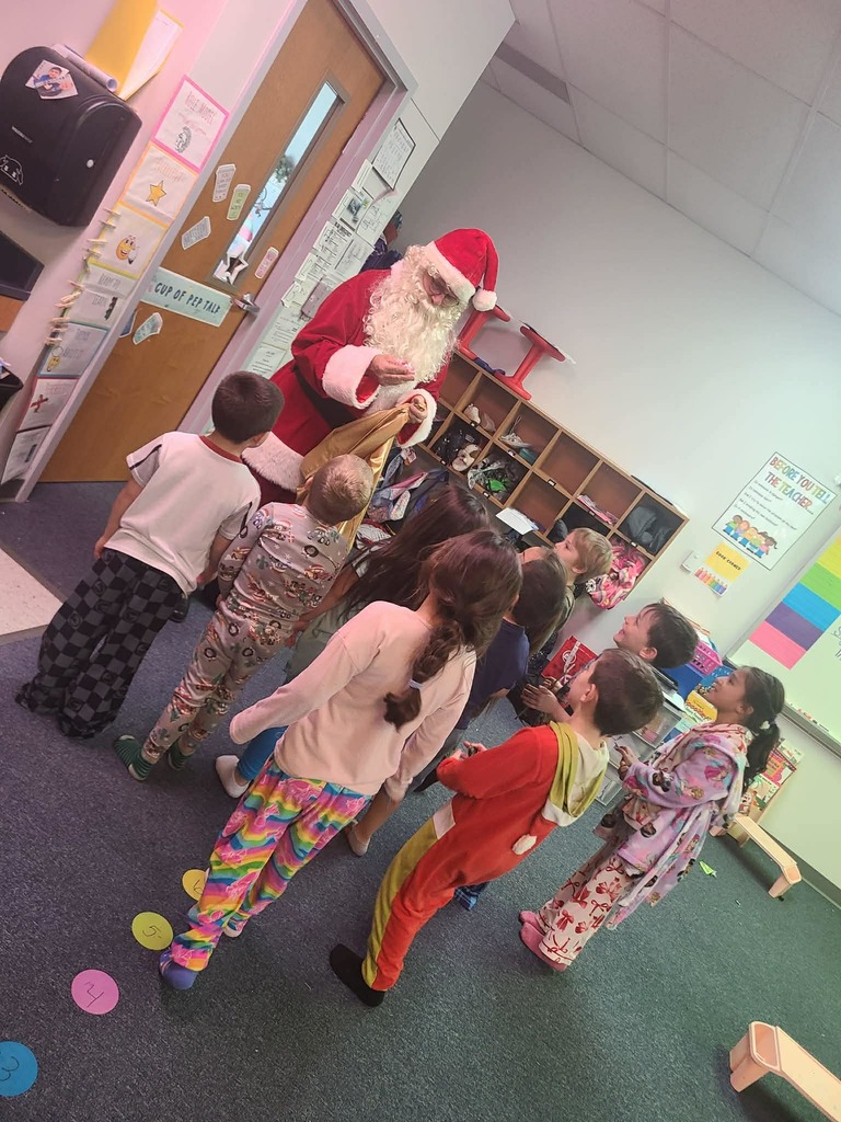 Kindergartner pics of visit from Santa and grinch