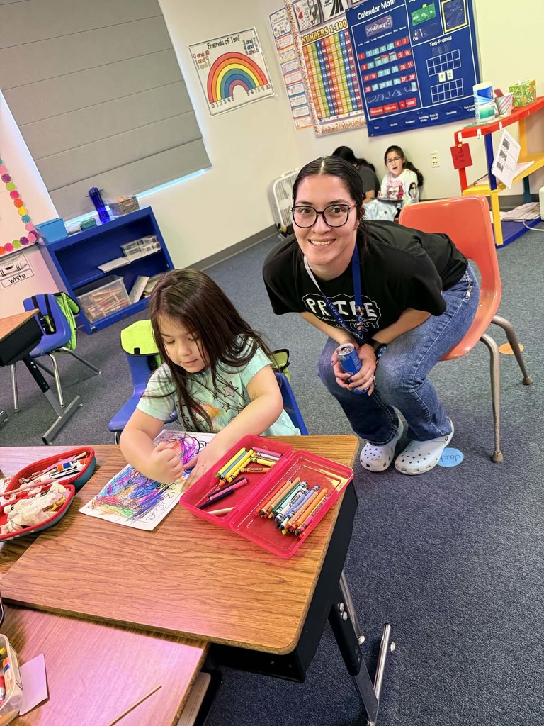 6th graders reading with the kindergartners 