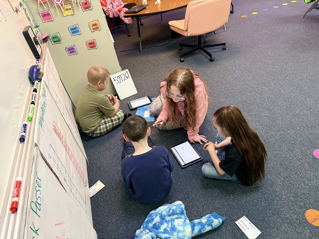 6th graders reading with the kindergartners 