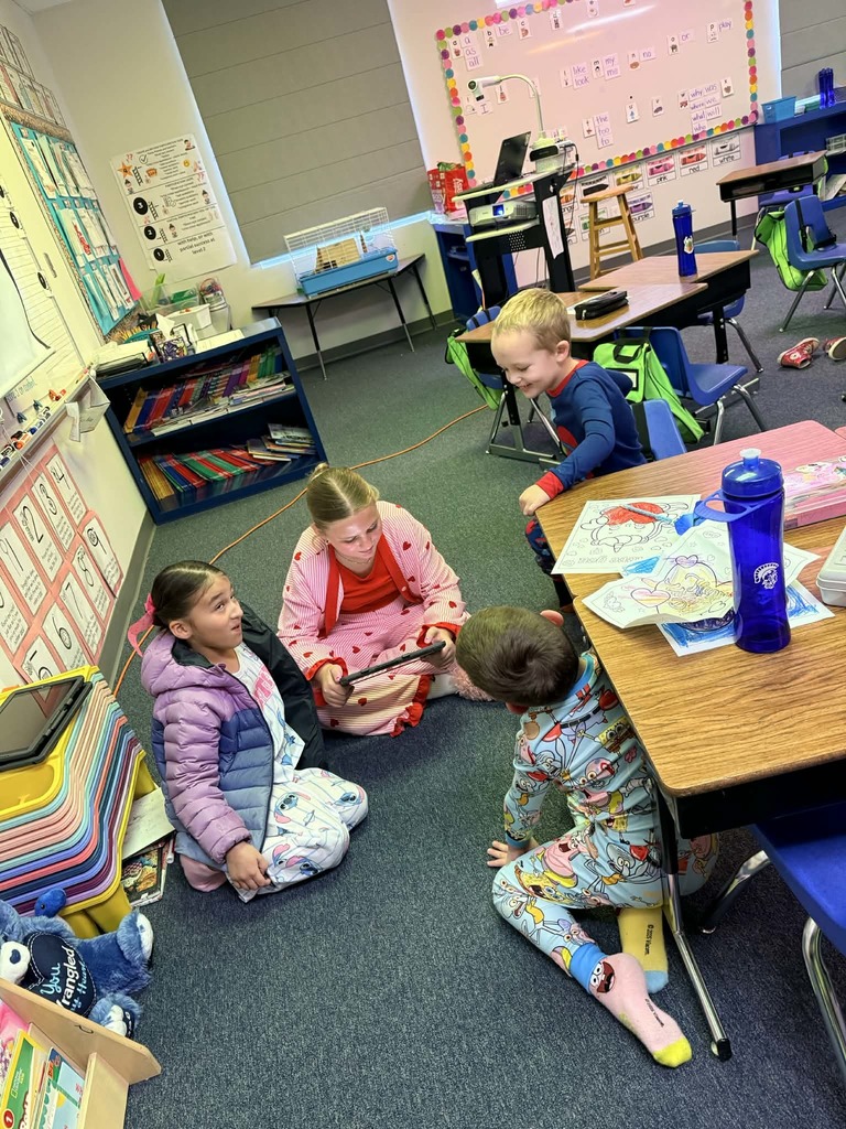 6th graders reading with the kindergartners 