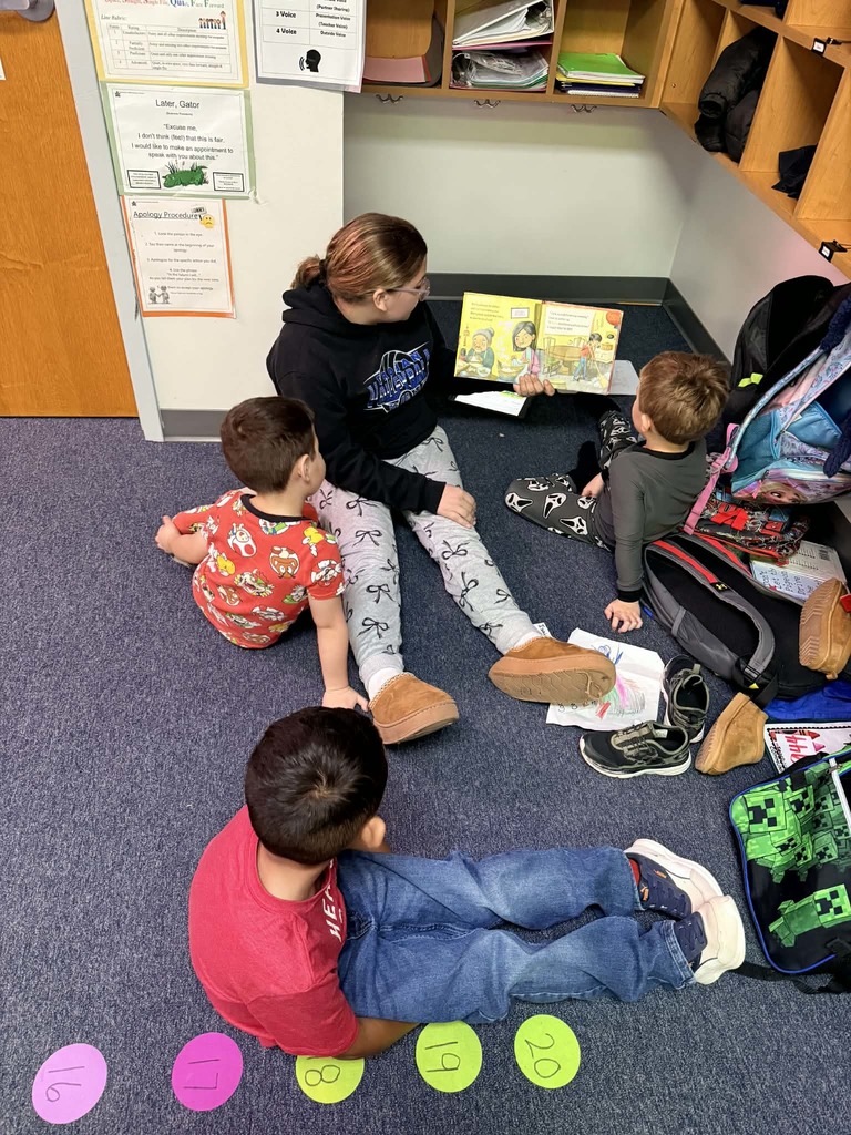 6th graders reading with the kindergartners 