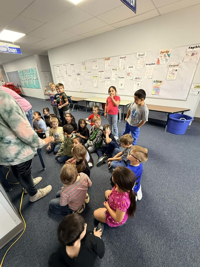 Kindergarten class pics putting eggs in incubator 
