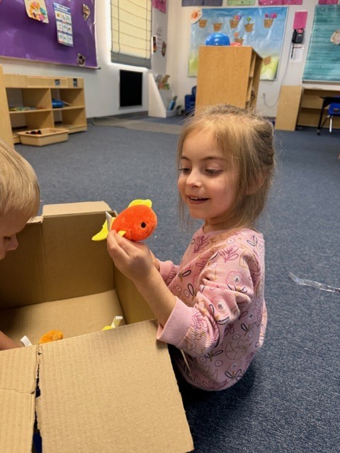 Pics of preschool class "adopting" a pet